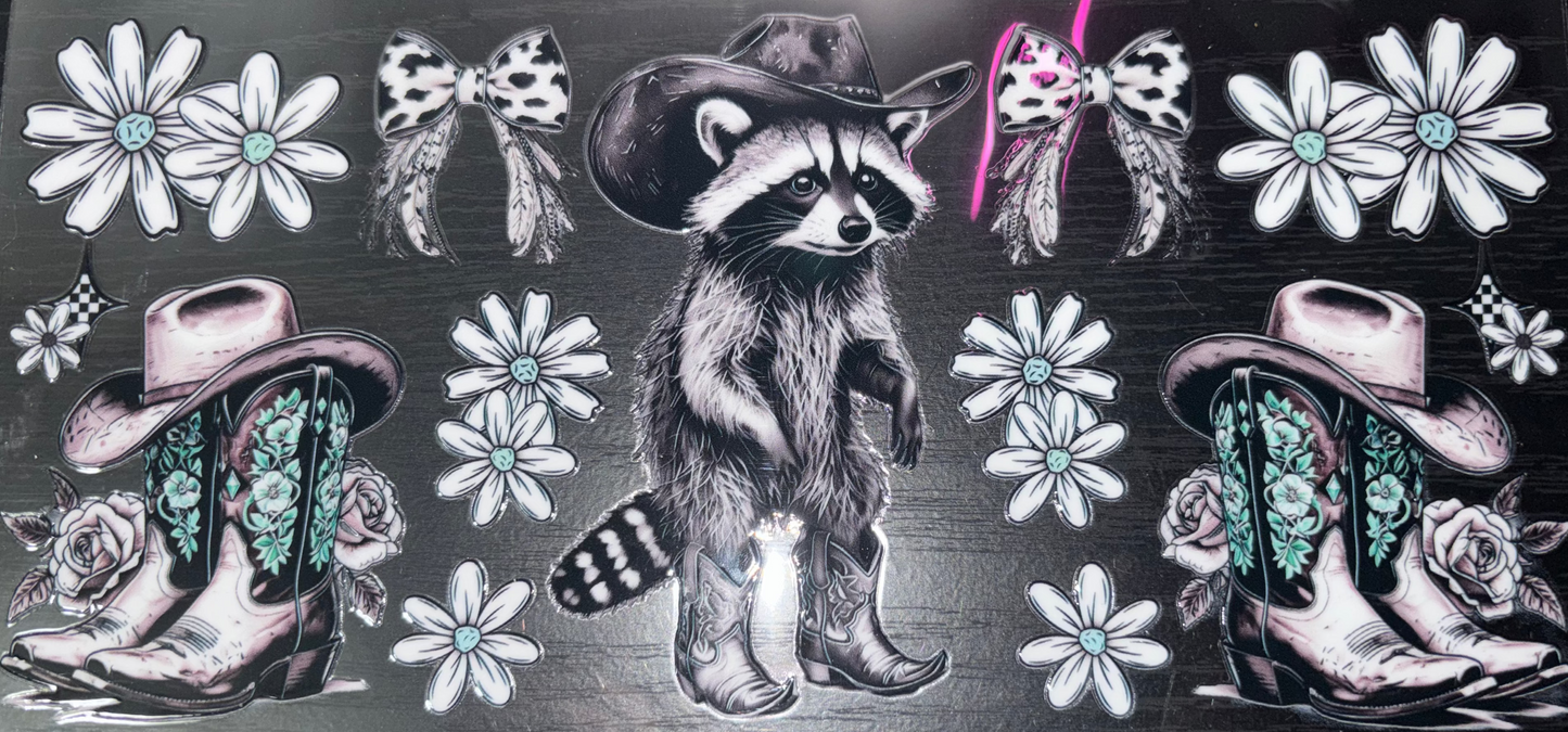 Sheet with raccoons, flowers, and decorative elements on a black background.